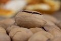 cracked unpeeled pecans close-up on the table