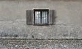 Cracked wall with old wooden window. Stone texture background