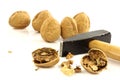 A cracked walnut with a hammer Royalty Free Stock Photo