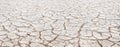 Cracked white clay on dried lake bed, natural pattern with diminishing perspective Royalty Free Stock Photo