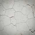 Cracked white wall surface displaying an irregular pattern of fissures and flaking. The texture is Royalty Free Stock Photo