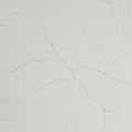 Cracked white wall surface displaying a network of fine lines spread across the Royalty Free Stock Photo
