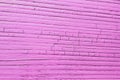 Cracked wooden plank, pink color