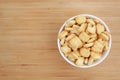 Cracker or Cookie ABC letter alphabet in white bowl on wooden background Royalty Free Stock Photo