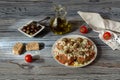 . Crackers with grated tomatoes, feta cheese, oregano, olives and olive oil