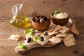 Crackers with soft cheese and olives. healthy appetizer