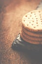 Crackers stack together on black stone, wooden background.Copy s Royalty Free Stock Photo