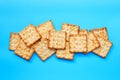 Crackers with sugar on blue background