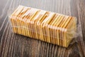 Crackers in transparent wrapper on wooden table