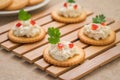 Crackers with tuna salad on wooden plate Royalty Free Stock Photo