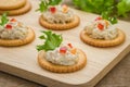 Crackers with tuna salad on wooden plate Royalty Free Stock Photo