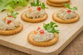 Crackers with tuna salad on wooden plate Royalty Free Stock Photo