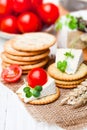 Crackers and wedge of blue camembert cheese on sackcloth napkin Royalty Free Stock Photo