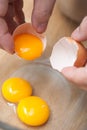 Cracking eggs and seperate yolk from albumen Royalty Free Stock Photo