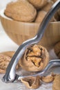 Cracking and shelling walnuts Royalty Free Stock Photo