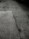Cracks in the asphalt. Grunge background of broken asphalt Royalty Free Stock Photo