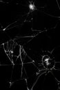 cracks on black glass background, broken abstract glass hole destruction concept