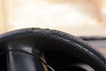 cracks and damaged rubber of the car steering wheel due to long exposure to the sunlight, substandard materials in the manufacture