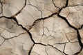 Cracks and fissures mar the dry, damaged surface of the earth