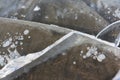 Cracks and frozen bubbles on a river surface in winter Royalty Free Stock Photo