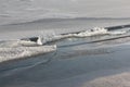 Cracks with ice crystals on frozen river in backlight Royalty Free Stock Photo