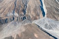 Cracks on surface of mine tailings at abandoned asbestos mine in Amiantos, Cyprus