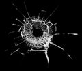 Bullet hole in the glass. Isolated on a black background. Royalty Free Stock Photo