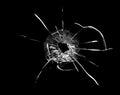 Bullet hole in the glass. Isolated on a black background. Royalty Free Stock Photo