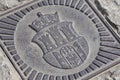 Cracow Coat of arms / arm made of metal. Symbol of Krakow city emblem closeup. Concept of Cracow steel family crest