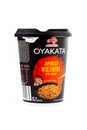 A plastic cup of Ajinomoto Oyakata Japanese Beef flavored instant soup, noodles in a black container on white, object cut out