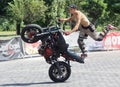 Young motorbiker performing stunts on his tuned bike