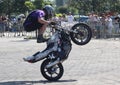Young motorbiker performing stunts on his tuned bike