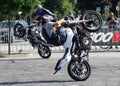 Young motorbiker performing stunts on his tuned bike