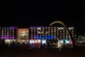 Exterior view of shopping centre Galeria Krakowska and modern Arch at night