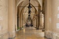 Interior of tunnel with arcades Sukiennice hall at center of market square