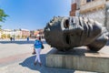 Cracow-Poland-Mitoraj sculpture and woman tourist Royalty Free Stock Photo