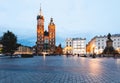 Cracow, Poland old town with St. Mary's Basilica and Adam Mickiewicz monument at the evening