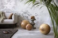 Craetive compostion of indiustral living room interior with design gray sofa, wooden ball, modern coffee table, gray concrete Royalty Free Stock Photo