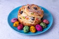 Craffin Cruffin with raisins, nuts and candied fruits. Easter Bread Kulich and painted eggs. Easter Holiday.