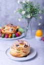 Craffin Cruffin with raisins, nuts and candied fruits. Easter Bread Kulich and painted eggs. Easter Holiday.