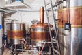 Craft beer brewing equipment in brewery Metal tanks, alcoholic drink production. Royalty Free Stock Photo