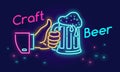 Craft beer glass and thumbs up symbol icon in neon light style on dark background. Royalty Free Stock Photo