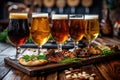 Craft beer tasting. Different types of beer in glasses on a wooden table. Royalty Free Stock Photo