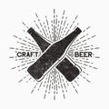 Craft beer - vintage grunge logo. Emblem for pub, bar with bottle and sunburst. Retro typography poster. Vector.
