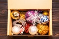 Craft box with Christmas decorations. Top view Royalty Free Stock Photo