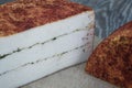 Craft cheese from cows and goats milk. Cheese head. Selective focus Royalty Free Stock Photo
