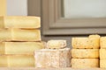 Craft cheese at the fair sale on the counter Royalty Free Stock Photo