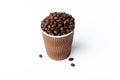 Craft coffee cup full of coffee bean on white background