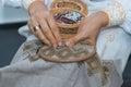 Craft embroidery, woman`s hands decorate handmade linen canvas with color thread, embroider traditional Ukraininan ornament