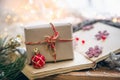 Craft gift box and Christmas decor details on a blurred background. Royalty Free Stock Photo